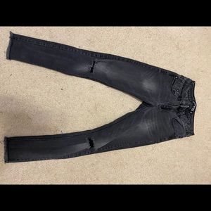 black jeans with rip on the knees